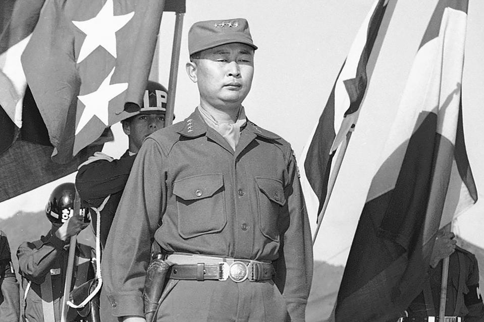 FILE - This Oct. 29, 1953, file photo shows Gen. Paik Sun-yup on the reviewing stand in South Korea. Former South Korean army Gen. Paik who was celebrated as a major war hero for leading troops in several battle victories against North Korean soldiers during the 1950-53 Korean War, has died. He was 99. (AP Photo/Fred Waters, File)