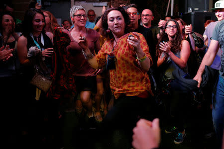 Mamak Khadem, who is Iranian-American, dances with the audience at the ContraBand Showcase featuring artists representing countries included in U.S. President Donald Trump's executive order travel bans, at the South by Southwest (SXSW) Music Film Interactive Festival 2017 in Austin, Texas, U.S. March 17, 2017. REUTERS/Brian Snyder