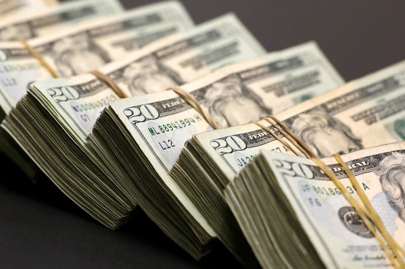 FILE PHOTO: Bundles of banknotes of U.S. Dollar are pictured at a currency exchange shop in Ciudad Juarez, Mexico January 15, 2018. REUTERS/Jose Luis Gonzalez/File Photo