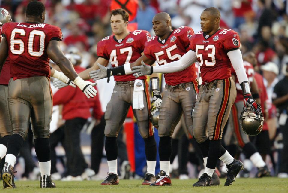 Shelton Quarles, right, is a former teammate of new 49ers GM John Lynch, second from left, and says he’ll have a lot to learn on the job. (Getty Images)