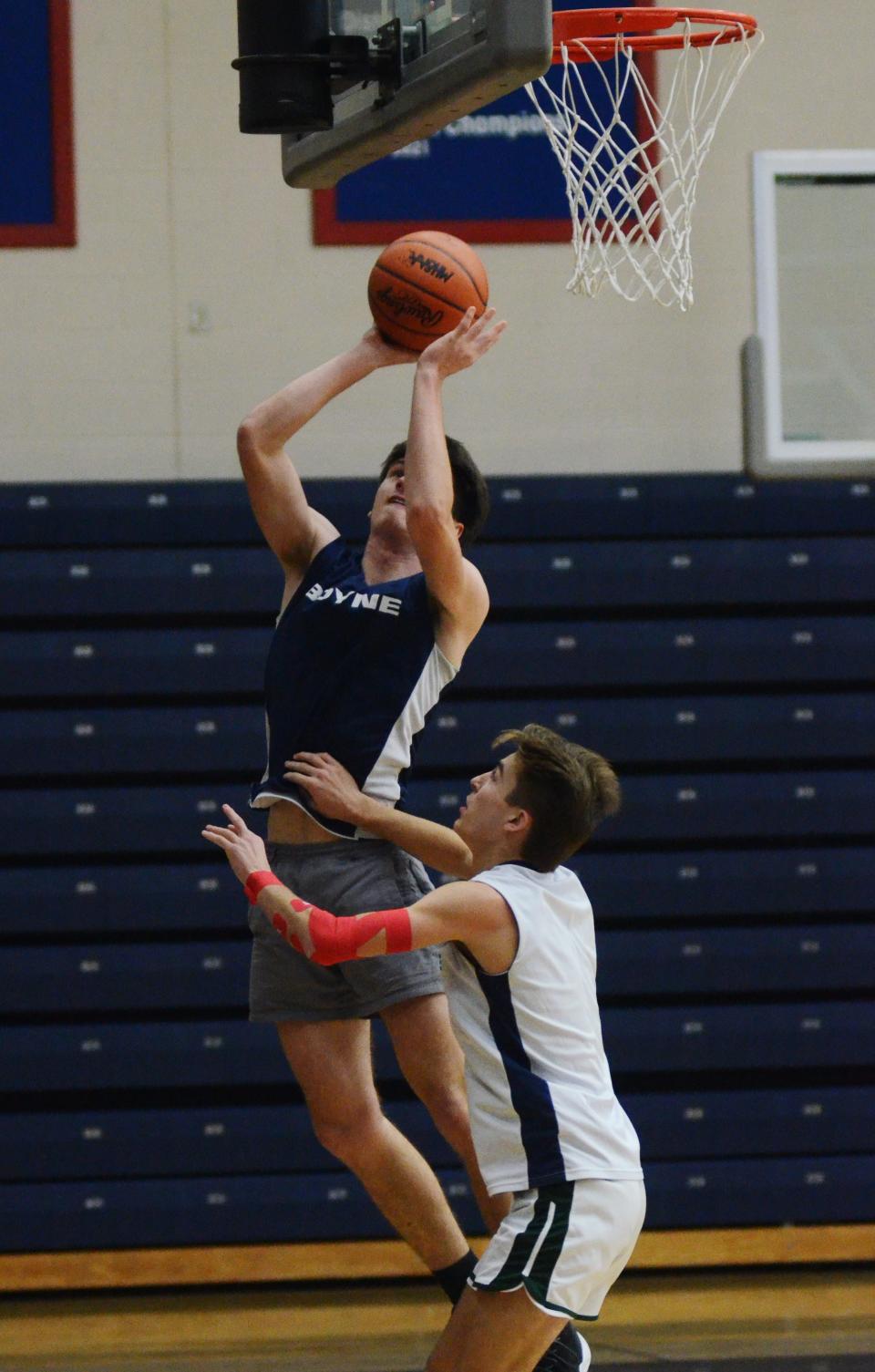 Boyne City's Chas Stanek gets a shot up over teammate Mason Wilcox during practice this week.