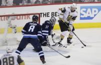 May 20, 2018; Winnipeg, Manitoba, CAN; Vegas Golden Knights left wing Erik Haula (56) prepares to shoot against Winnipeg Jets goaltender Connor Hellebuyck (37) in the second period in game five of the Western Conference Final of the 2018 Stanley Cup Playoffs at Bell MTS Centre. Mandatory Credit: James Carey Lauder-USA TODAY Sports