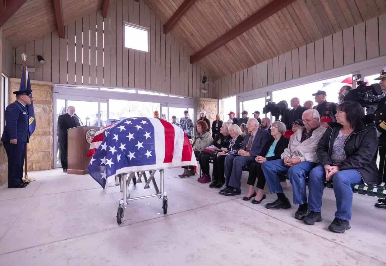 Reverend Larry Mort presides over a service for Fireman 1st Class Walter Schleiter during his military funeral at National Cemetaries of the Alleghanies in Bridgeville PA, Thursday April 11, 2024.