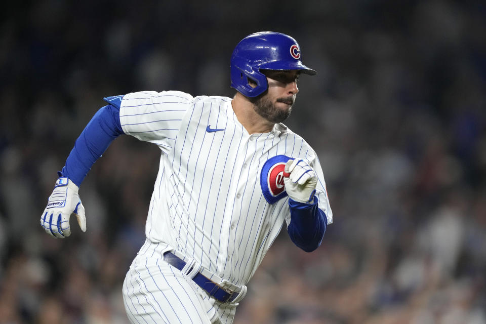 Chicago Cubs' Mike Tauchman runs after hitting an RBI double off Pittsburgh Pirates relief pitcher Colin Holderman during the eighth inning of a baseball game Thursday, Sept. 21, 2023, in Chicago. (AP Photo/Charles Rex Arbogast)