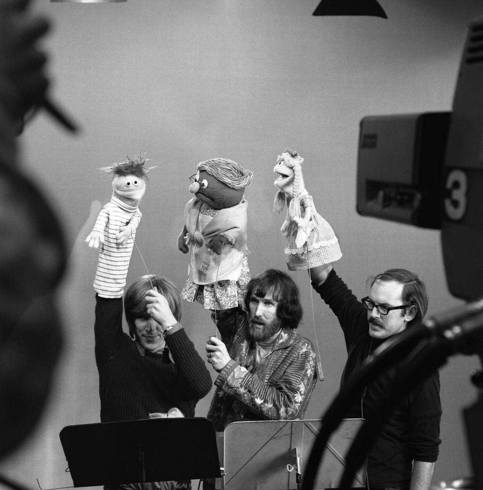 Puppeteers Daniel Seagren (holding Roosevelt Franklin), Jim Henson (holding Grandmother Happy) and Frank Oz (holding Betty Lou) rehearse for an episode at Reeves TeleTape Studio.