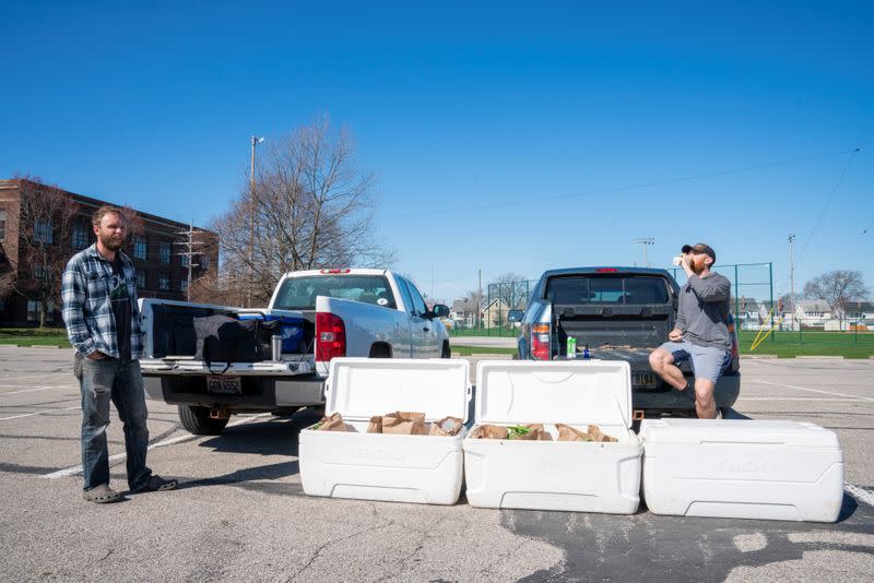 Tim Kelly and Jimmy Myers stock product at one of four pickup spots in Madison Park