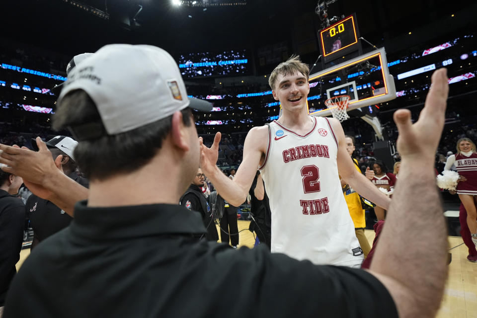 Alabama forward Grant Nelson celebrates after a win over Clemson in an Elite 8 college basketball game in the NCAA tournament Saturday, March 30, 2024, in Los Angeles. (AP Photo/Ashley Landis)