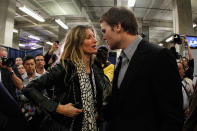 INDIANAPOLIS, IN - FEBRUARY 05: Tom Brady #12 of the New England Patriots chats with his wife Gisele Bundchen after losing to the New York Giants by a score of 21-17 in Super Bowl XLVI at Lucas Oil Stadium on February 5, 2012 in Indianapolis, Indiana. (Photo by Rob Carr/Getty Images)