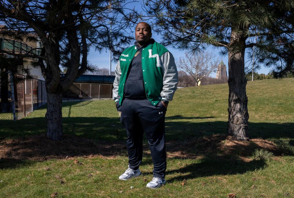 Marcus Green, athletic director and head football coach at Cornerstone Lincoln-King High School, stands near the Wayne State University football field in Detroit on Friday, March 29, 2024. Green was one of eight high school coaches in the country chosen for the National Coalition of Minority Football Coaches UFL fellowship, which will put him on the coaching staff of the USFL Michigan Panthers.