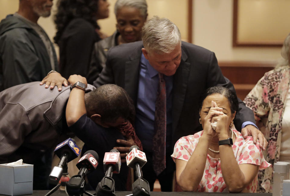 Lisa Berry, right, is comforted by attorney Robert Mongeluzzi while Kyrie Rose is comforted by a family member following a news conference regarding the July 19 duck boat accident, Tuesday, July 31, 2018, in Indianapolis. A second lawsuit has been filed by members of an Indiana family who lost nine relatives when a tourist boat sank this month in Missouri. The federal lawsuit was filed Tuesday in Missouri on behalf of the estates of two members of the Coleman family. They were among 17 people killed in the July 19 sinking near Branson. (AP Photo/Darron Cummings)