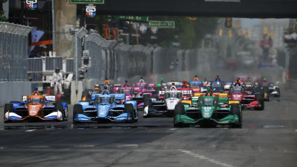 Álex Palou (10) leads the field during the IndyCar Detroit Grand Prix auto race in Detroit, Sunday, June 4, 2023. (AP Photo/Paul Sancya)