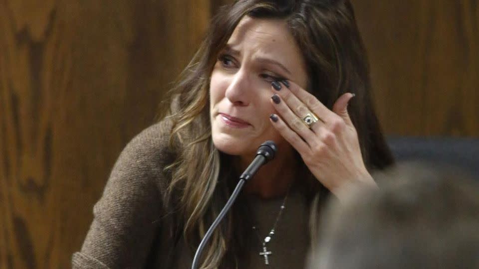Taya Kyle, wife of slain Navy SEAL Chris Kyle, wipes away tears when viewing images of her husband during her testimony on the witness stand. Source: AP