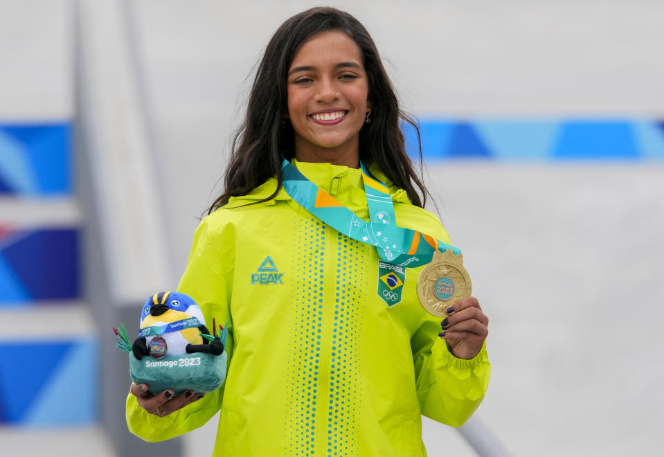 Brazil's Rayssa Leal shows the gold medal during the awards ceremony of the women's skateboarding street at the Pan American Games in Santiago, Chile, Saturday, Oct. 21, 2023. (AP Photo/Esteban Felix)