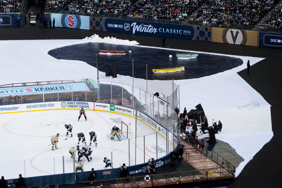 The Seattle Kraken and the Vegas Golden Knights face off during the first period of the NHL Winter Classic hockey game, Monday, Jan. 1, 2024, in Seattle. (AP Photo/Lindsey Wasson)