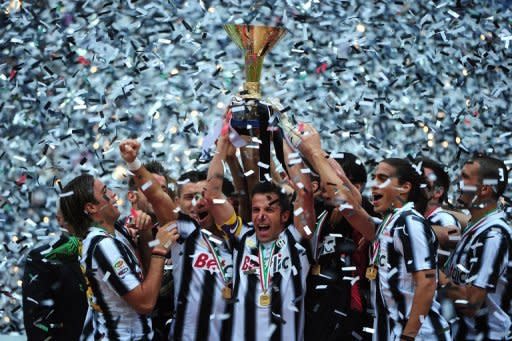 Juventus captain Alessandro Del Piero (C) holds the Serie A trophy, the Scudetto, after they defeated Atalanta on May 13. Champions Juventus broke AC Milan's record of 42 matches unbeaten and finished the league season undefeated with a 3-1 win over Atalanta