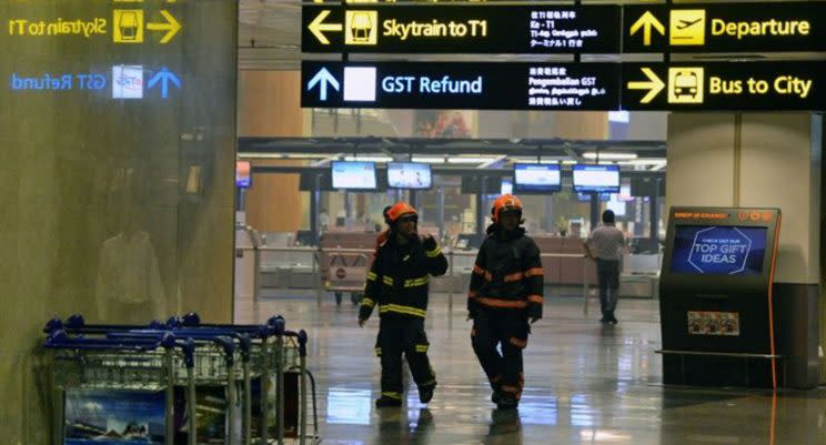 Firefighters at Changi Airport on Tuesday 16 May. Photo: AFP