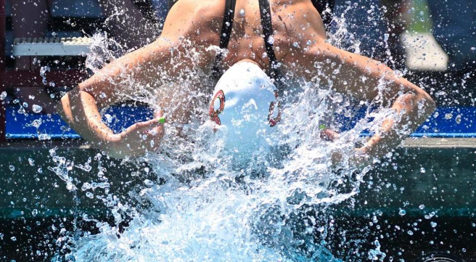 Clovis West’s Hannah Marinovich splashes herself at the starting block as she prepares for the 100 breaststroke at the 2023 CIF swimming and diving state championships on Saturday, May 13, 2023 in Fresno.