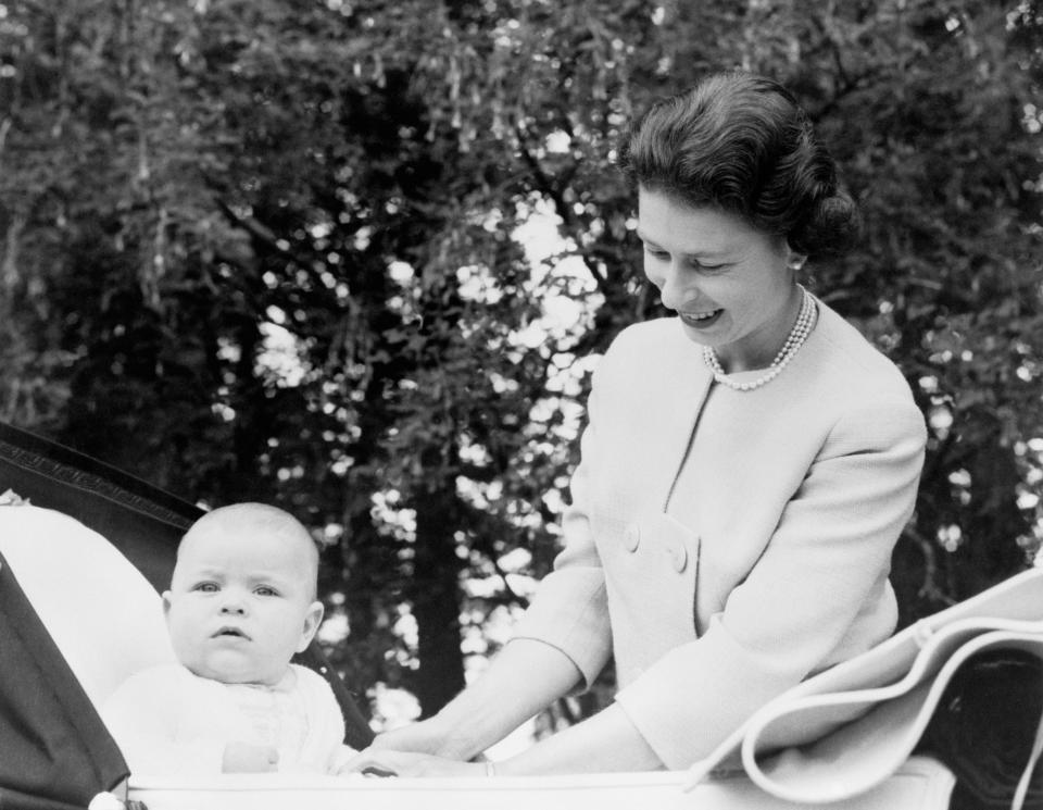 <p>The Queen with her third child, Prince Andrew, at Balmoral in 1960. He was born on 19 February that year at Buckingham Palace. (PA Images via Getty Images)</p> 