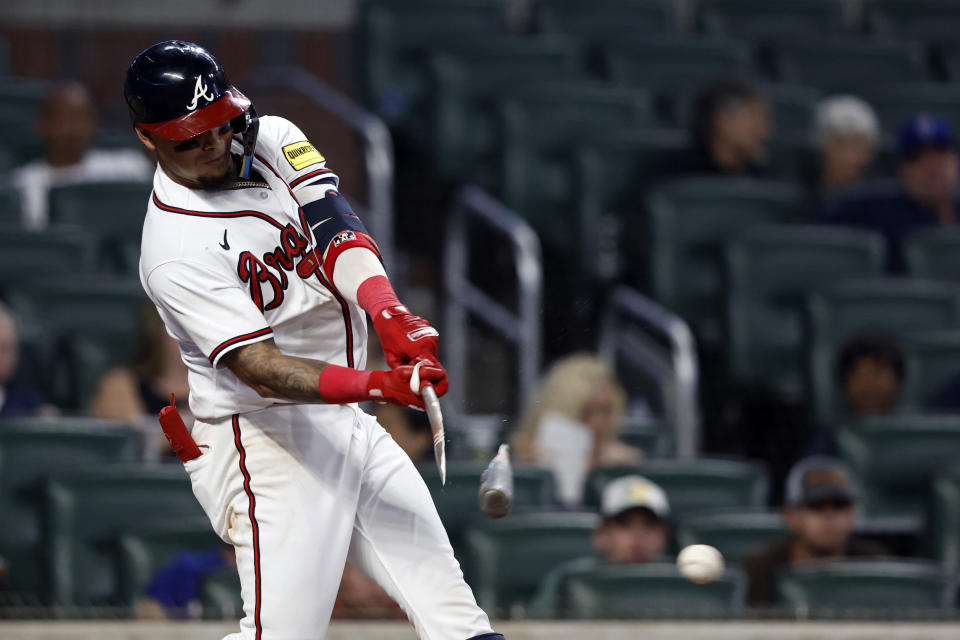 Atlanta Braves' Orlando Arcia breaks the bat as he hits during the eighth inning of a baseball game against the New York Mets Tuesday, Aug. 22, 2023, in Atlanta. (AP Photo/Butch Dill)