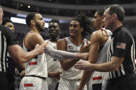 Connecticut's Isaiah Whaley, center, reacts toward an official during the first half of the team's NCAA college basketball game against Villanova, Tuesday, Feb. 22, 2022, in Hartford, Conn. (AP Photo/Jessica Hill)