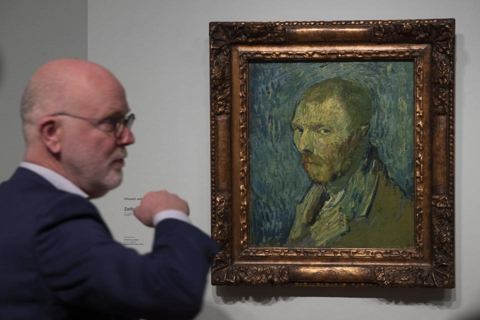 Senior researcher Louis van Tilborgh talks to journalists about the previously contested painting by Dutch master Vincent van Gogh, a 1889 self-portrait, of which the authenticity was confirmed during a press conference in Amsterdam, Netherlands, Monday, Jan. 20, 2020. The painting, which belongs to the National Museum in Norway, was painted at the Saint-Paul de Mausole psychiatric institution in Saint-Remy de Provence, France. (AP Photo/Peter Dejong)