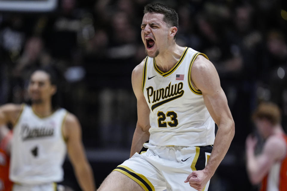 Purdue forward Camden Heide (23) celebrates after a three-point basket against Illinois during the first half of an NCAA college basketball game in West Lafayette, Ind., Friday, Jan. 5, 2024. (AP Photo/Michael Conroy)