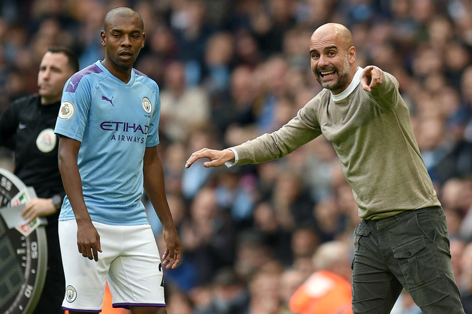 Pep Guardiola (right), Fernandinho and Manchester City are already eight points off the top of the Premier League table. What's gone wrong? (Getty)