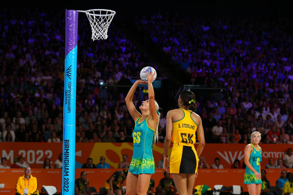 Gretel Bueta (pictured) shoots during a netball match.