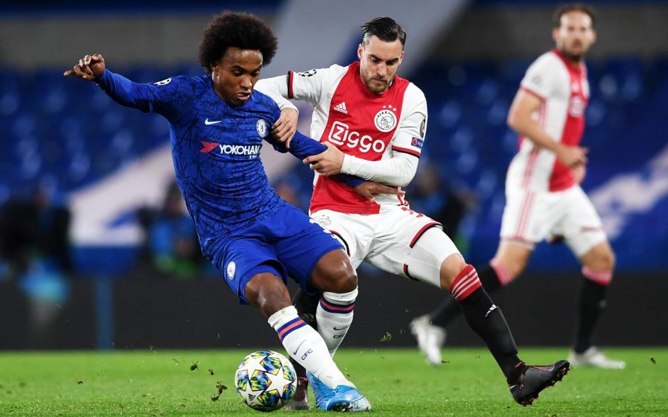 Nicolas Tagliafico of Ajax attempts to tackle Willian in this season's Champions League - REX