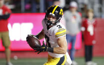 Iowa defensive back Cooper DeJean (3) returns an interception for a touchdown against Rutgers during the first half of an NCAA college football game, Saturday, Sept. 24, 2022, in Piscataway, N.J. (AP Photo/Noah K. Murray)