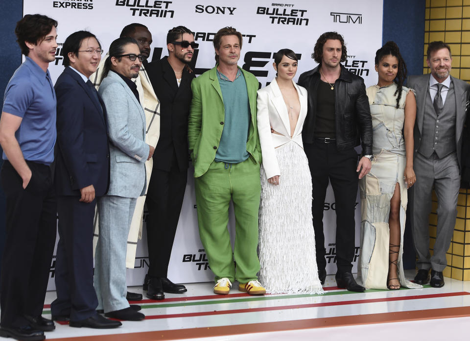 The cast of "Bullet Train" pose on the red carpet at the film's premiere on Monday, Aug. 1, 2022, at the Regency Village Theatre in Los Angeles. Pictured from left is Logan Lerman, Masi Oka, Hiroyuki Sanada, Brian Tyree Henry, Bad Bunny, Brad Pitt, Joey King, Aaron Taylor-Johnson, Zazie Beetz and director David Leitch. (Photo by Jordan Strauss/Invision/AP)