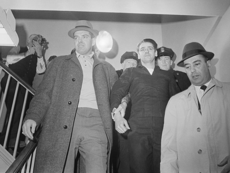 Albert DeSalvo is led from a press conference at the Lynn police station after his capture in a West Lynn uniform store in 1967.