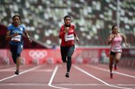 <p>Iran's Fasihi Farzaneh (C) Kuwait's Mudhawi Alshammari (L) and Nepal's Sarswati Chaudhary (R) compete in the women's 100m heats during the Tokyo 2020 Olympic Games at the Olympic Stadium in Tokyo on July 30, 2021. (Photo by Jewel SAMAD / AFP)</p> 