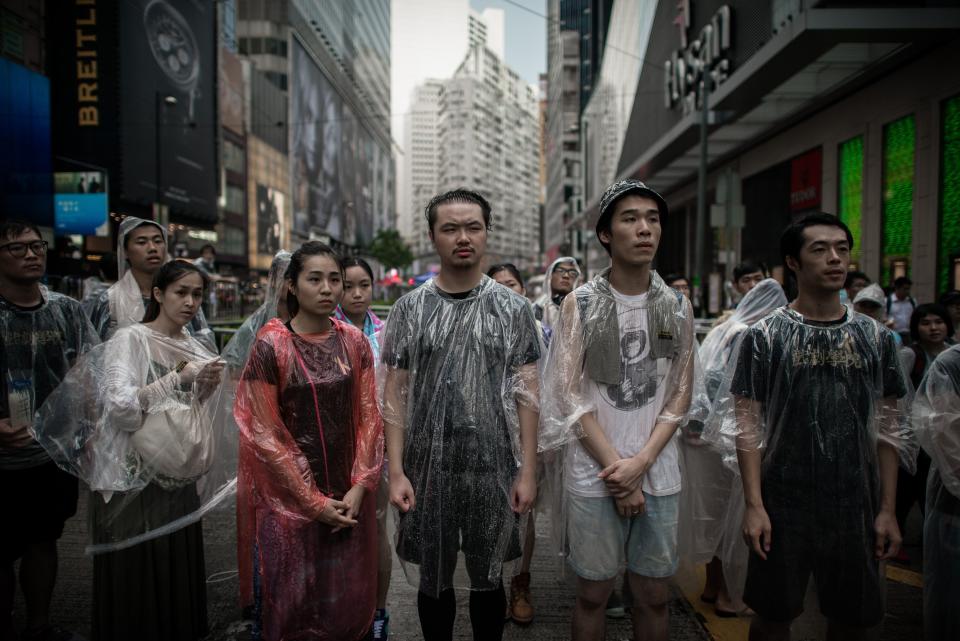 Pro-democracy demonstrators look on as they protect a barricade from anti-protesters in an occupied area of Hong Kong on October 3, 2014. (PHILIPPE LOPEZ/AFP/Getty Images)