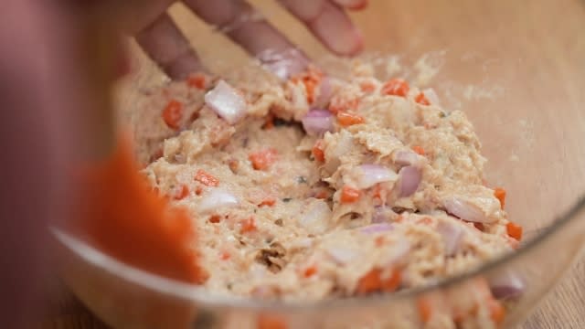 mixing saba fish filling in a bowl for breakfast cups