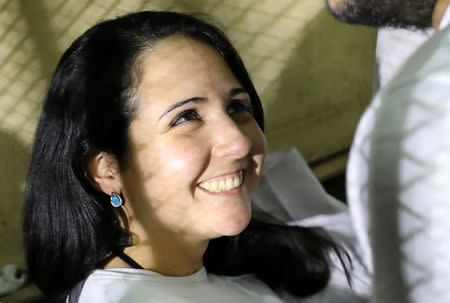 Aya Hijazi, founder of Belady, an NGO that promotes a better life for street children, is seen inside a holding cell as she faces trial on charges of human trafficking at a courthouse in Cairo, Egypt March 23, 2017. REUTERS/Mohamed Abd El Ghany