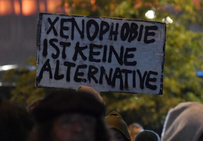 A protester holds up a sign reading "Xenophobia is not an alternative" after the nationalist AfD in Germany was projected to become the country's third largest party (AFP Photo/John MACDOUGALL)