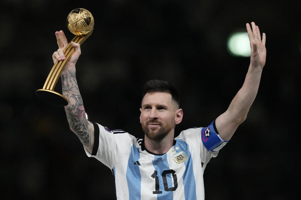 FILE - Argentina's Lionel Messi waves after receiving the Golden Ball award for best player of the tournament at the end of the World Cup final soccer match between Argentina and France at the Lusail Stadium in Lusail, Qatar, Sunday, Dec. 18, 2022. Lionel Messi says he is coming to Inter Miami and joining Major League Soccer. After months of speculation, Messi announced his decision Wednesday, June 7, 2023,to join a Miami franchise that has been led by another global soccer icon in David Beckham since its inception but has yet to make any real splashes on the field.(AP Photo/Martin Meissner, File)