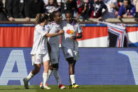 Lyon's Melchie Dumornay, center, celebrates after scoring her side's second goal during the women's Champions League semifinal, second leg, soccer match between Paris Saint-Germain and Olympique Lyonnais at Parc des Princes, in Paris, Sunday, April 28, 2024. (AP Photo/Thibault Camus)