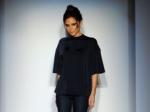 Victoria Beckham poses on the runway at the end of her show.
