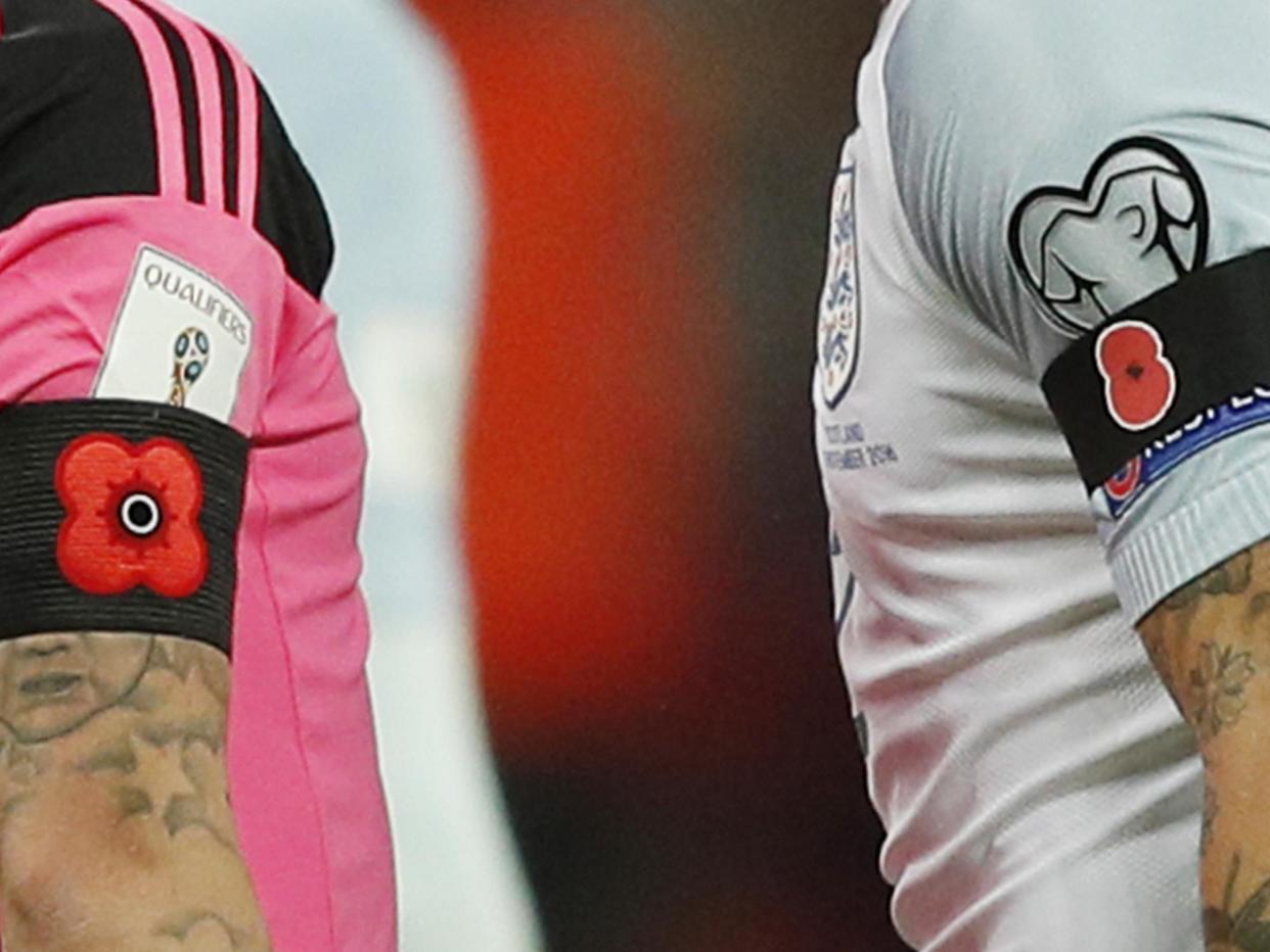 Scotland and England players wore commemorative poppies on black armbands last November: AFP/Getty Images