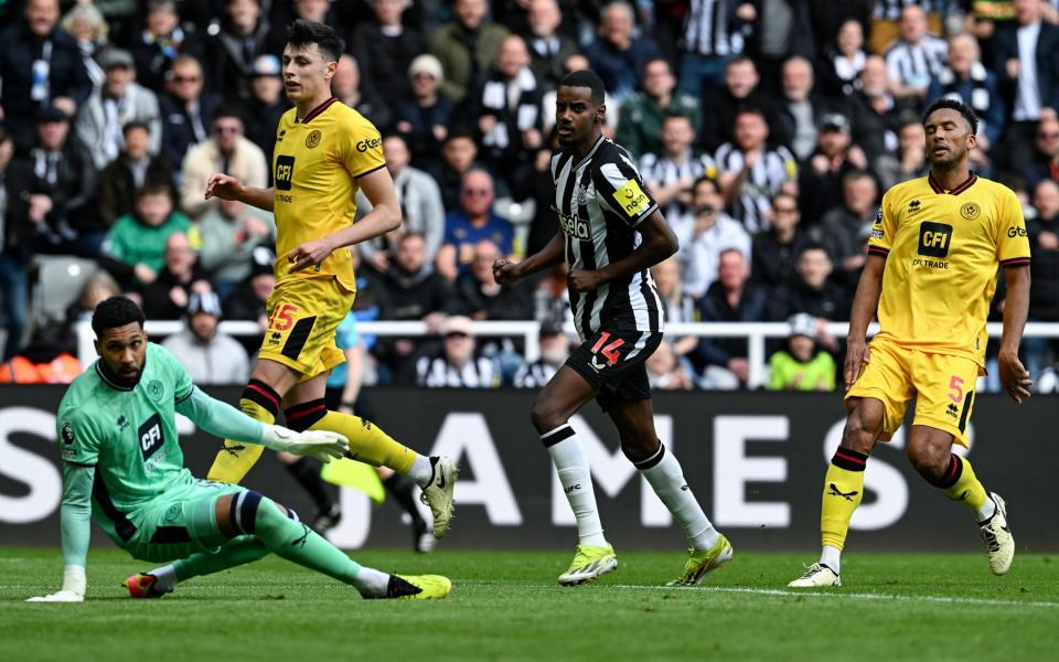 Alexander Isak of Newcastle United (14) scores Newcastles first goal during the Premier League match between Newcastle United and Sheffield United