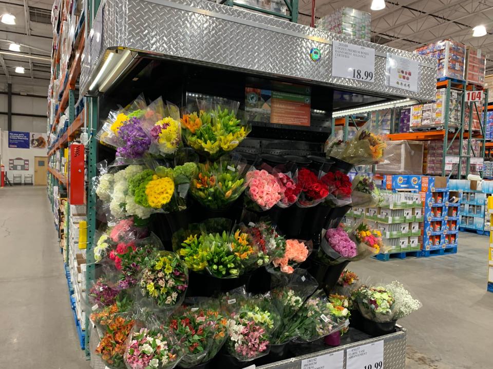 cooler full of flower bouquets at costco