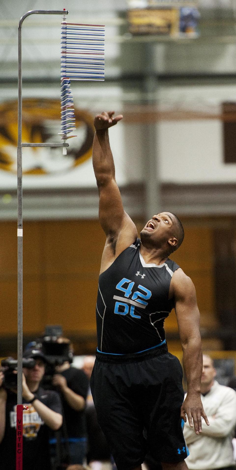 Defensive lineman Michael Sam participates in the vertical jump during Missouri's pro day for NFL football representatives Thursday, March 20, 2014, in Columbia, Mo. (AP Photo/L.G. Patterson)