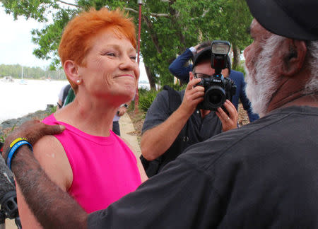 Australian senator Pauline Hanson talks with local Aboriginal man in the northern Australian town of Rockhampton in Queensland, Australia, November 8, 2017. Picture taken November 8, 2017. REUTERS/Jonathan Barrett