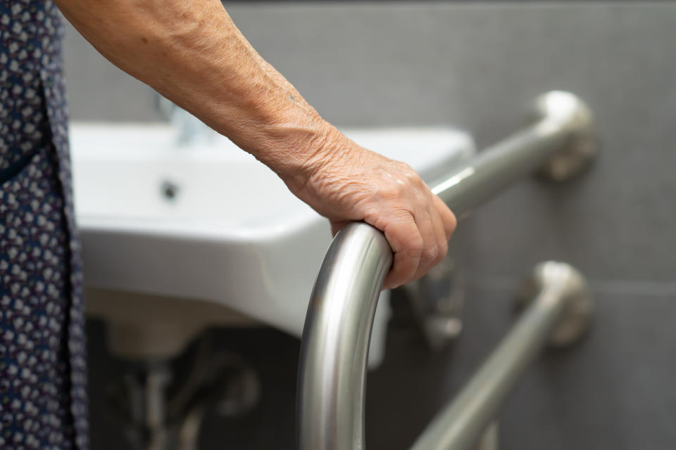 Asian senior or elderly old lady woman patient use toilet bathroom handle security in nursing hospital ward : healthy strong medical concept.