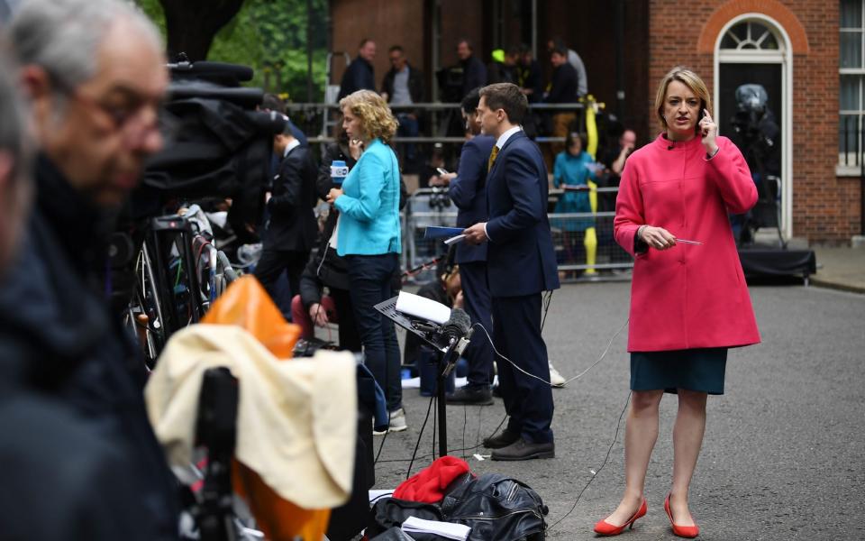 BBC political editor Laura Kuenssberg waits for Britain's Prime Minister to deliver a statement outside 10 Downing Street - Justin Tallis/AFP
