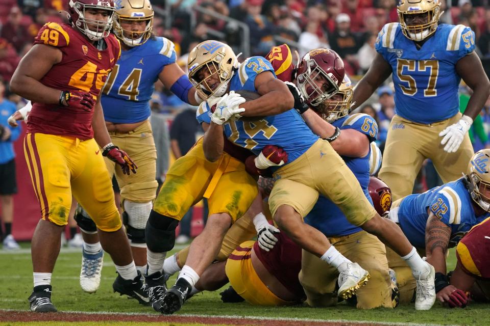 Oaks Christian School graduate Zach Charbonnet powers into the end zone for a touchdown during UCLA's 62-33 victory over rival USC on Nov. 20.