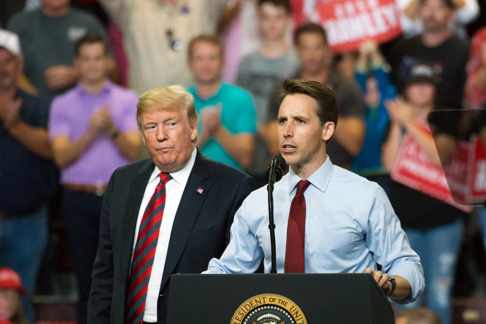 Josh Hawley, Republican senate candidate for Missouri, right, speaks as U.S. President Donald Trump looks on during a rally in Springfield, Missouri, U.S., on Friday, Sept. 21, 2018. (Neeta Satam/Bloomberg via Getty Images)