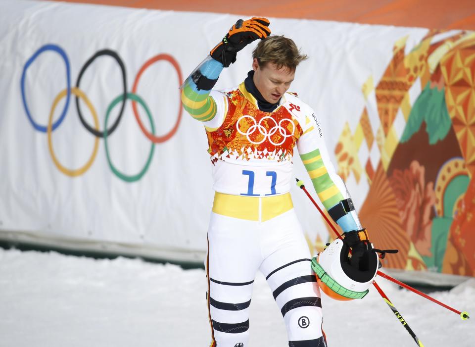 Germany's Stefan Luitz reacts after crashing into the last gate and being disqualified, during the first run of the men's alpine skiing giant slalom event in the Sochi 2014 Winter Olympics at the Rosa Khutor Alpine Center February 19, 2014. REUTERS/Kai Pfaffenbach (RUSSIA - Tags: OLYMPICS SPORT SKIING)